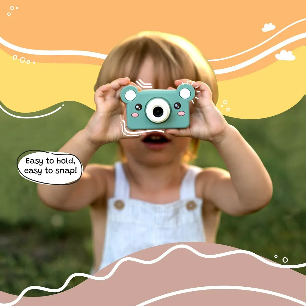 Young child using kiimento Model C Bear kids digital camera outdoors, easy to hold and snap photos.