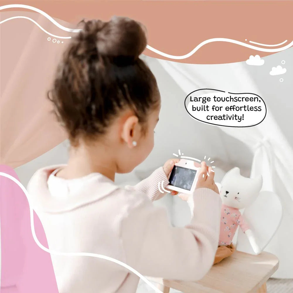 Young girl using the kiimento Meowie the Cat digital camera with a large touchscreen, capturing creative photos indoors with her toy.