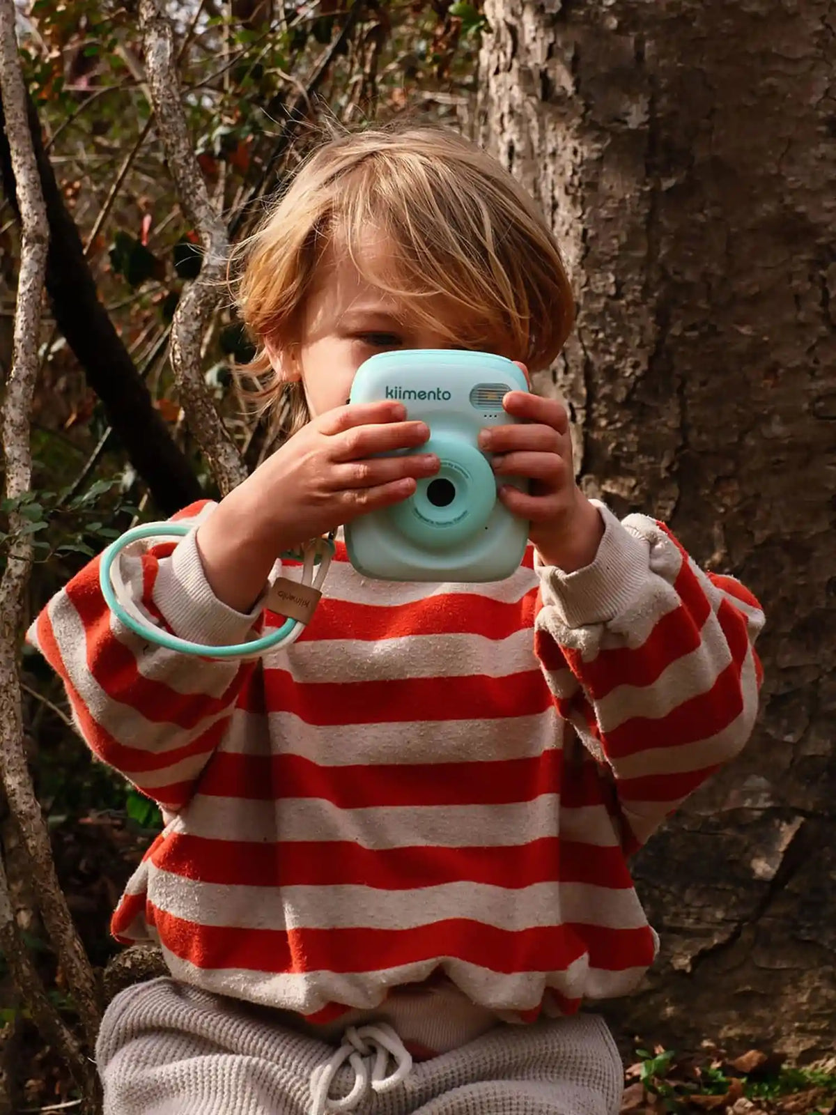 Child using kiimento Mint Print Pro Camera Model P2 outdoors – mint green instant print camera