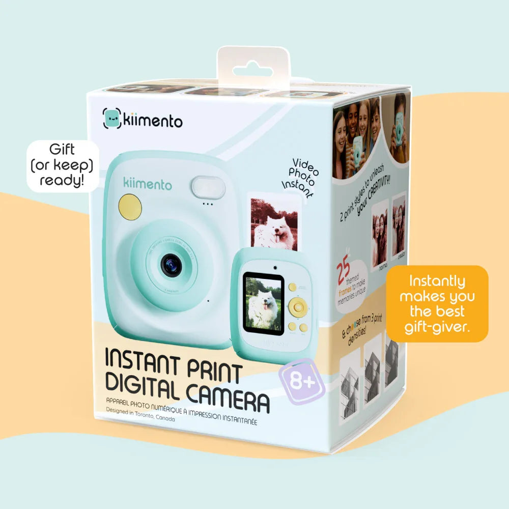 Mint Kiimento instant print digital camera with a dog photo on the screen.